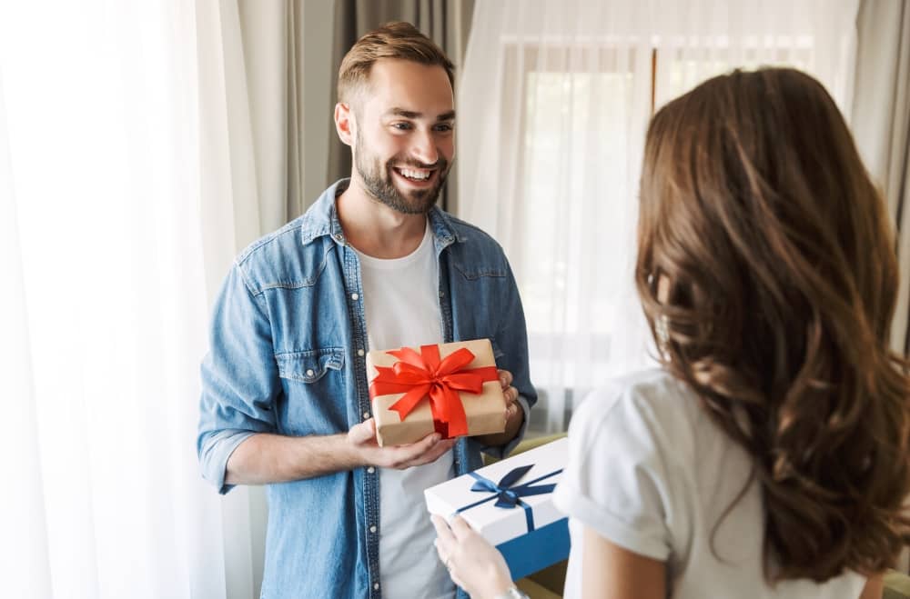 Couple exchanging anniversary gifts.