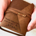 Leather Wrap around journal with the quote "where words fail, music speaks" engraved on bottom lefthand corner